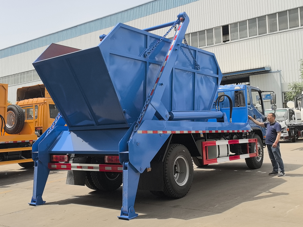 Skip loader truck